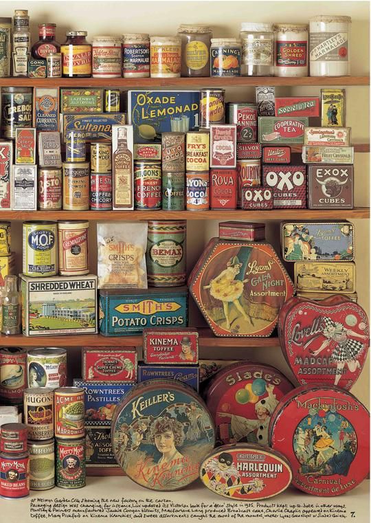 an assortment of vintage tins on shelves