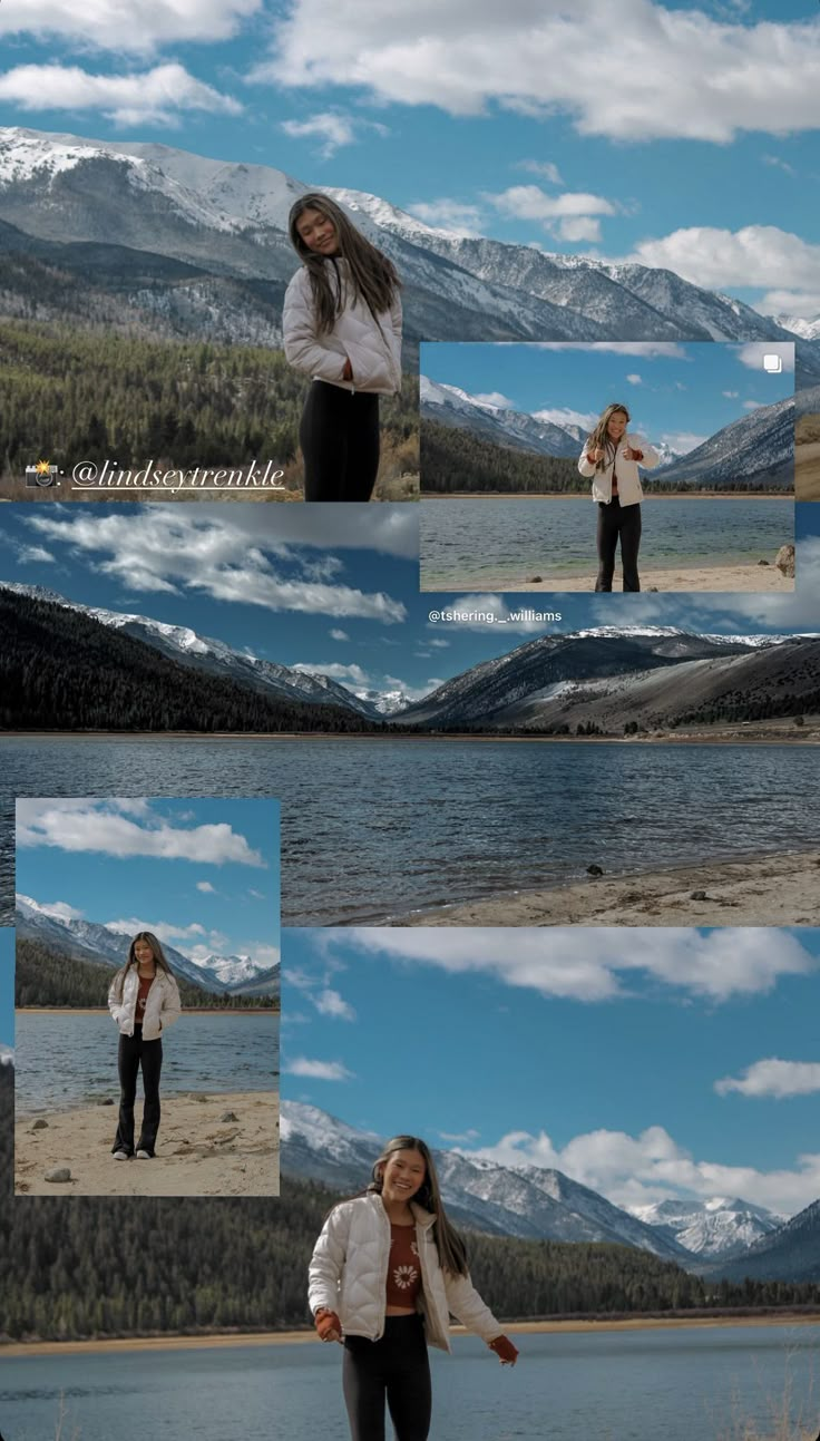 a woman standing on top of a mountain next to a lake and mountains in the background