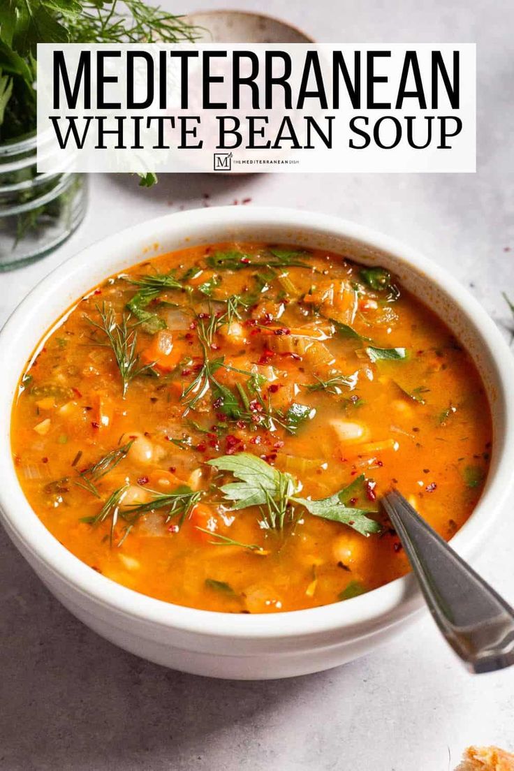 a bowl of white bean soup with herbs in it and the title overlay reads mediterraneanan white bean soup