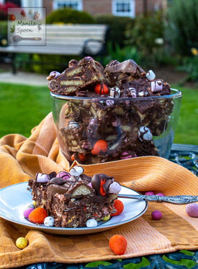 two pieces of chocolate candy barkle cake on a plate