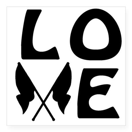 the word love is written in black and white with two crossed arrows on it,