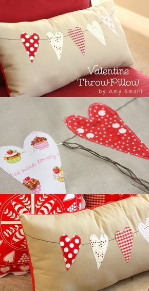 valentine pillows with hearts on them are sitting on the bed and one is made out of fabric