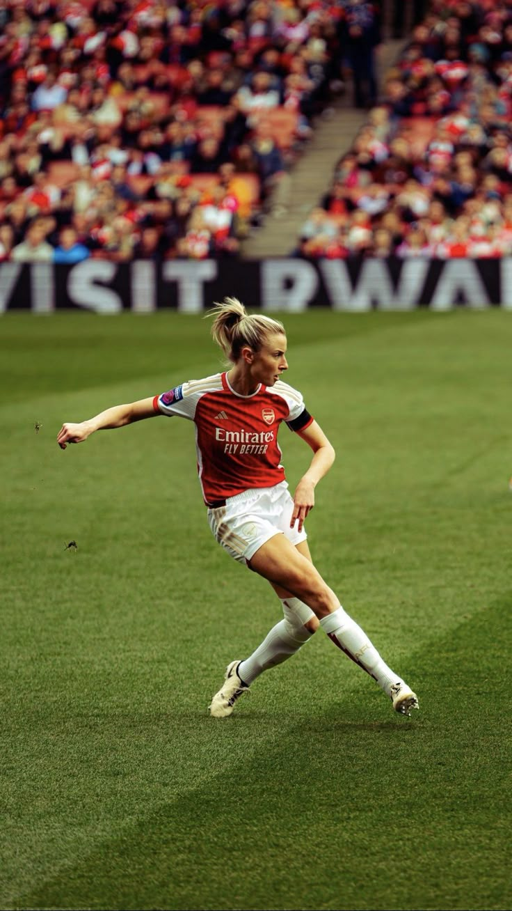 a female soccer player in action on the field