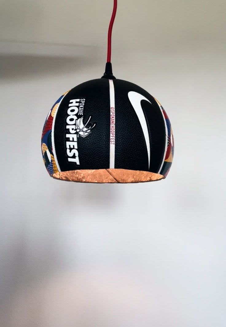 a basketball hanging from a ceiling in a room