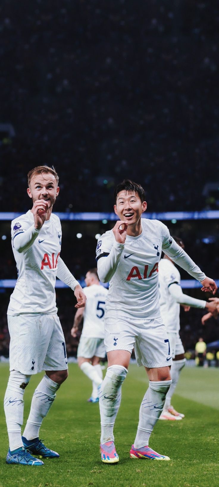 two soccer players are celebrating their team's win over the rest of the world