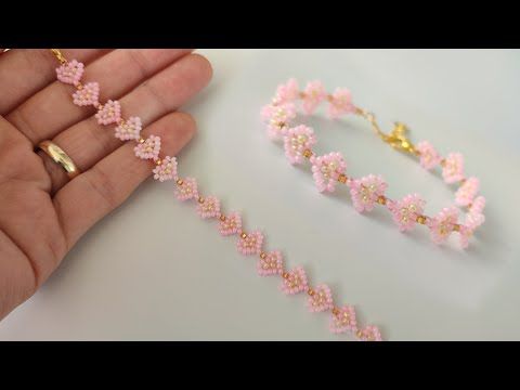 two pieces of pink beaded bracelets in hand