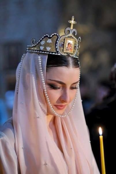 An Georgian bride wearing a liturgical crown (in church, during the wedding ceremony).  Recent picture (2010s). Armenian Women, Armenian Culture, Orthodox Wedding, National Clothes, Folk Costume, World Cultures, Bride Wear, A Cross, Armenia