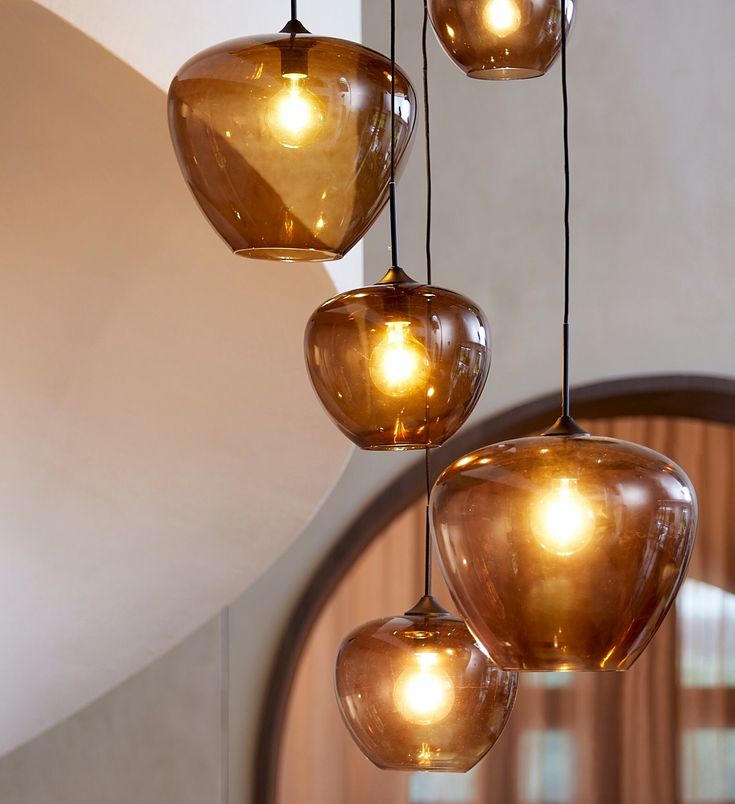 *Will be delivered in 2-3 weeks. This elegant pendant light is crafted using amber smoked glass and is a real feature in any room. Great on its own or in 2s or 3s etc., it looks great lit or unlit. It comes with 140cm of fabric fabric flex that can be shortened to any length and the metal ceiling fitting shown. It's also dimmable and takes any E27 bulb (large screw...or E26 in the USA). Size Approx: 30cm diameter x 25cm high. Amber Glass Pendant Light, Amber Pendant Light, Glass Kitchen Lights, Memphis House, Amber Lighting, Pears Soap, Diy Lights, Elegant Pendant Lighting, Bachelorette Pad