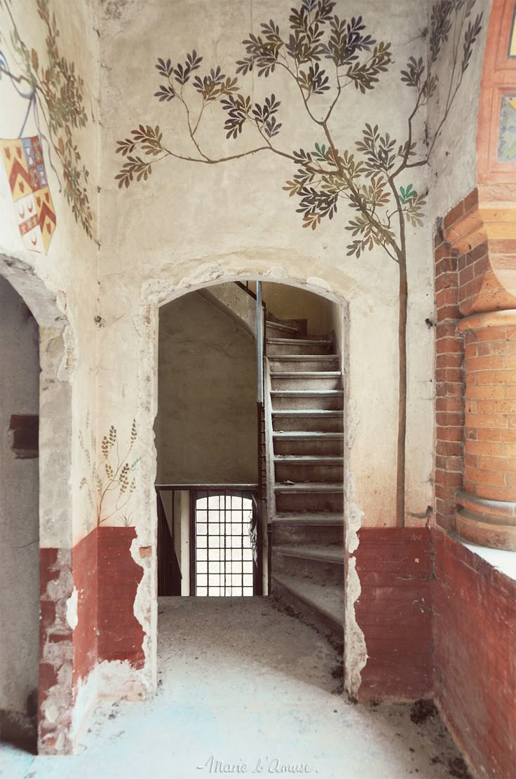 an empty room with stairs painted on the wall