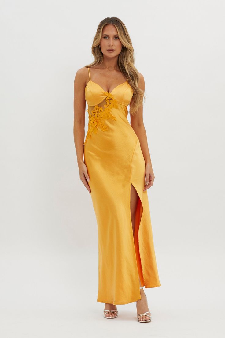 Satin maxi dress Partially lined No bust padding Adjustable straps Applique trim High, side split Sheer insert Zipper in side You'll feel like you just stepped off the red carpet in our stunning Roxana maxi dress. Featuring an applique trim and high split, it's perfect for glam special events or a birthday soiree. Team it with nude heels and a clutch for an unforgettable look. MODEL INFO Model is wearing size XS Height: 5'7" Bust: 32" Waist: 23.6" Hips: 32.5" CARE Hand Wash Cold. Do Not Iron. MA Yellow Bridesmaid Dresses, Red Bridesmaids, Yellow Bridesmaids, Split Maxi Dress, Satin Maxi, Lace Bodycon Dress, Dress Satin, Satin Maxi Dress, Mini Dress Casual