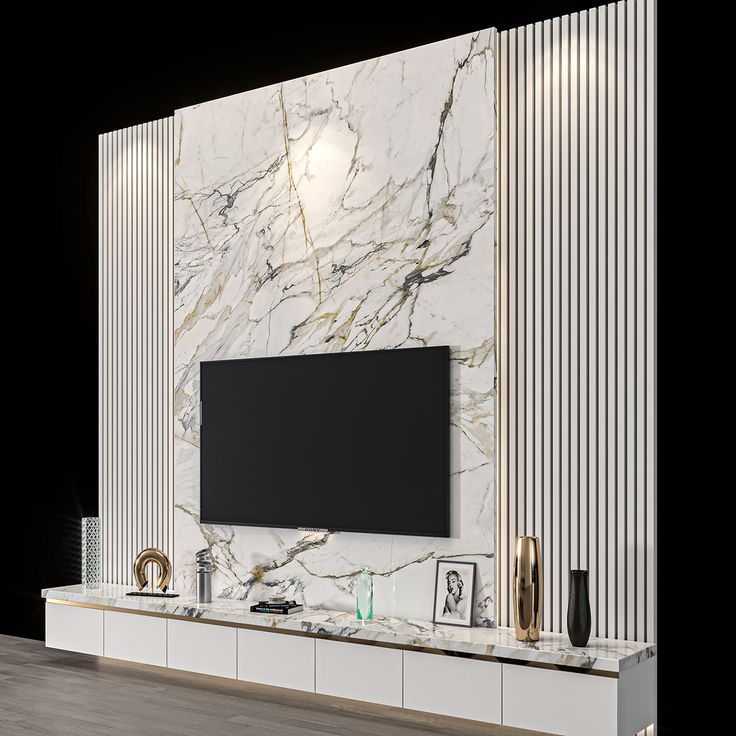 a large tv mounted on the side of a wall in a living room with white marble