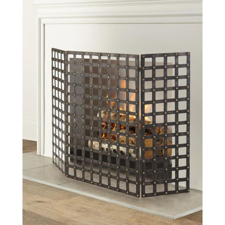 a fireplace screen with flames in it