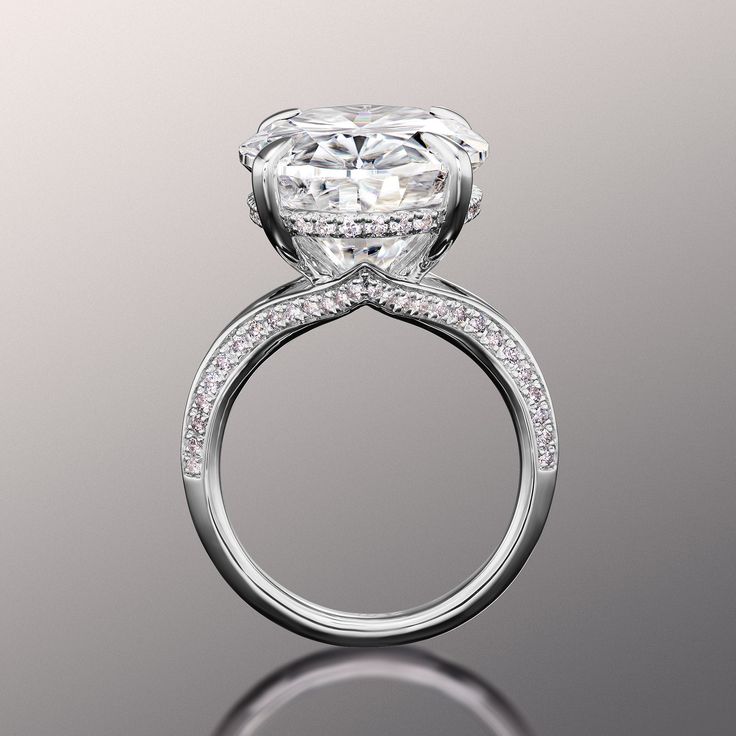 a diamond engagement ring on a reflective surface