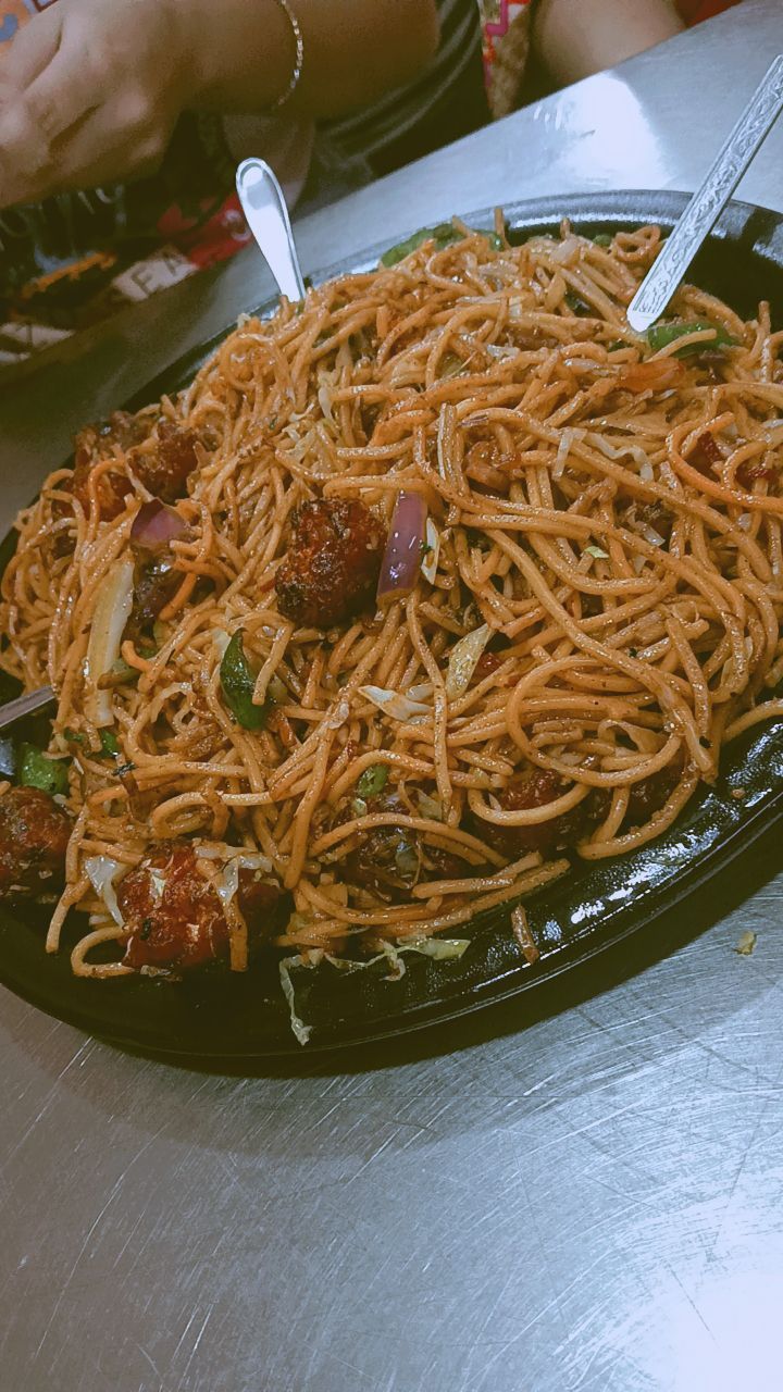 a plate full of spaghetti with meatballs on it