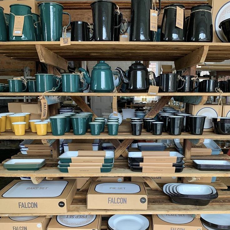 the shelves are filled with many different types of dishes