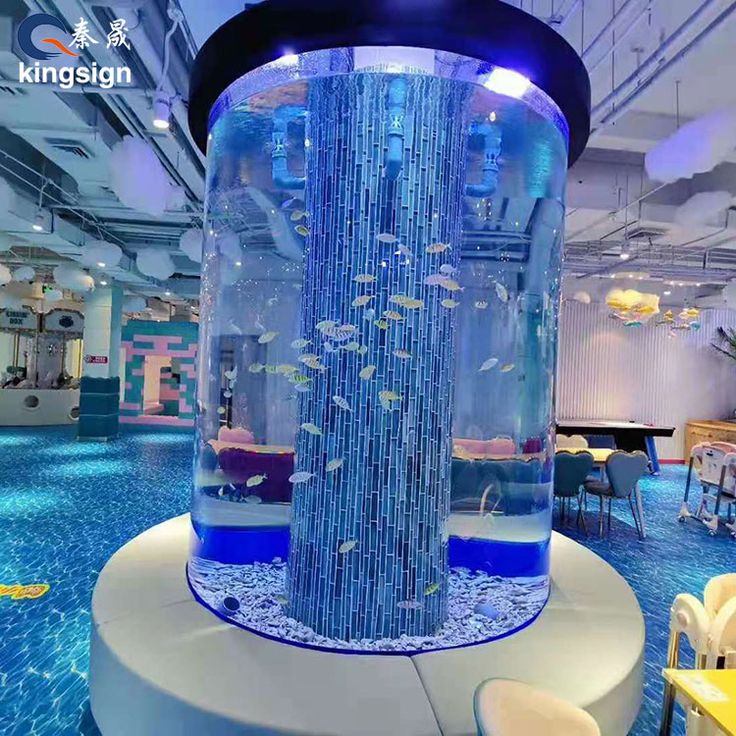 the inside of a building with a large aquarium in it