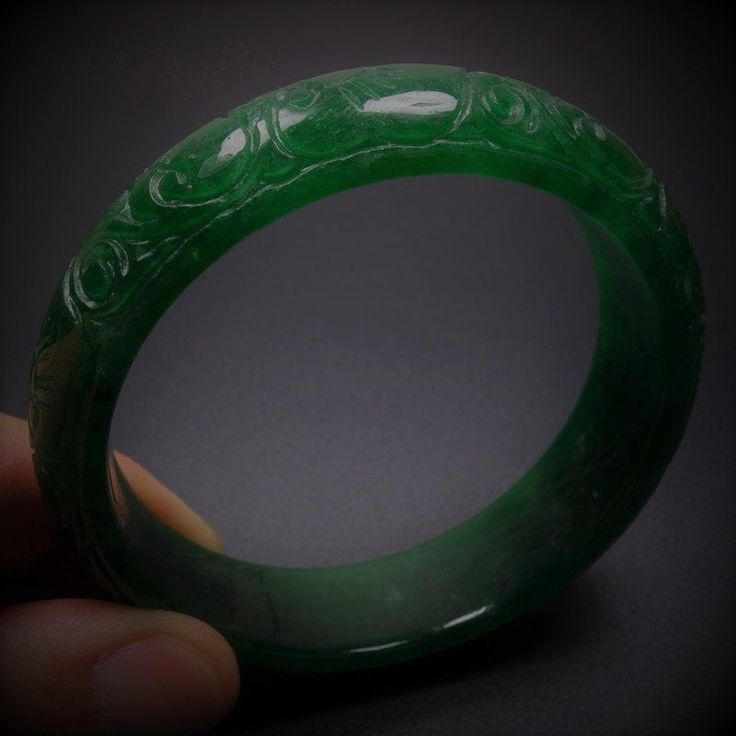 Vintage 59mm Hand-carved Green Jadeite Jade Bangle Bracelet #136 Size: 59 mm x 17mm x 9mm No certificate provided. Very nice condition. Want additional photos or have questions, just ask! Carved Jade Bangle As A Gift, Green Carved Bracelet As A Gift, Green Carved Bangle Bracelets, Green Carved Bangle Bracelet, Green Carved Bracelet For Gift, Green Carved Bracelets As Gift, Elegant Carved Green Bangle, Elegant Green Carved Bangle, Carved Jade Round Bracelets