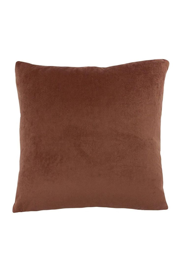 a brown pillow on a white background