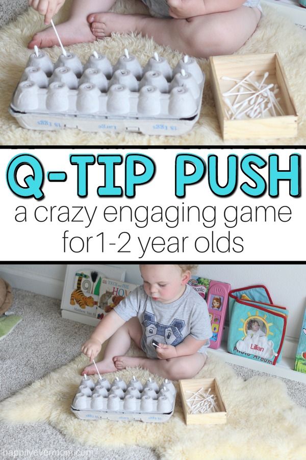 a baby sitting on the floor playing with an egg carton and eggs in it