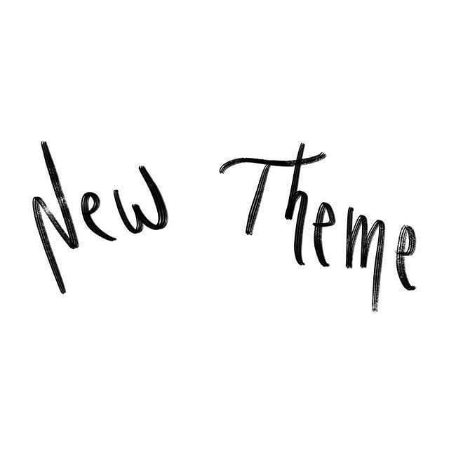 the word new theme is written in black ink on a white background with some type of writing