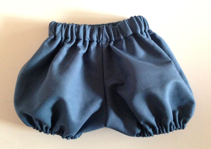 a pair of blue shorts sitting on top of a table