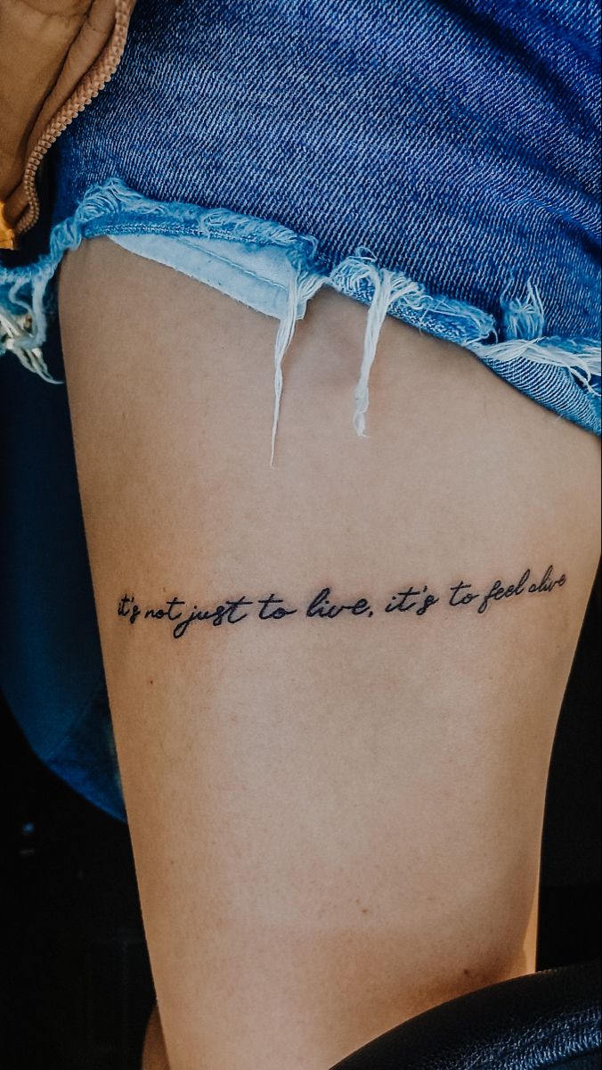 Aesthetic Female tattoo model Thigh Lettering Tattoos Women, Thigh Writing Tattoo, Thigh Quote Tattoo Women, Thigh Tattoos Women Words, Tattoo Writing Designs, Leg Quote Tattoo, Tattoo Pierna Mujer, Thigh Script Tattoo, Front Thigh Tattoos