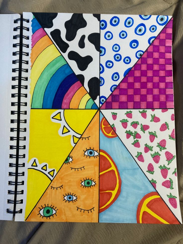 a spiral notebook with different designs on it