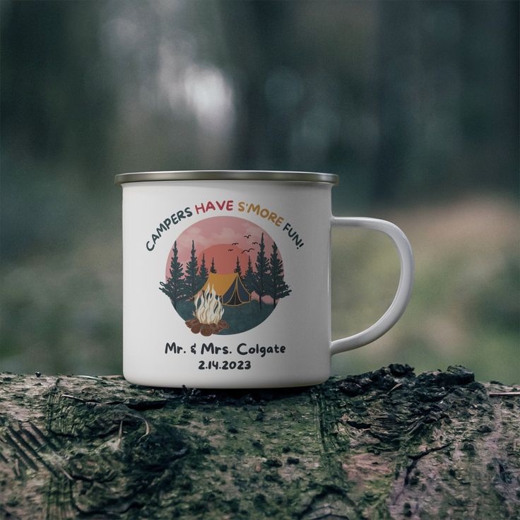 a camp mug sitting on top of a tree stump