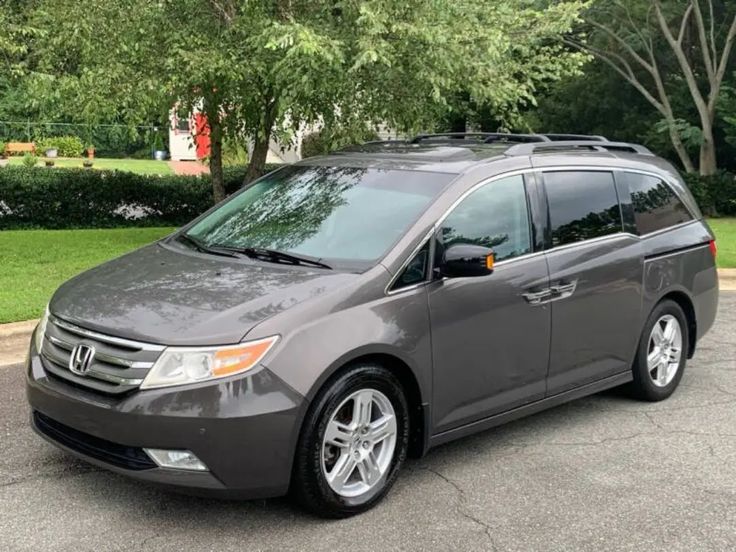 a gray van parked in a parking lot