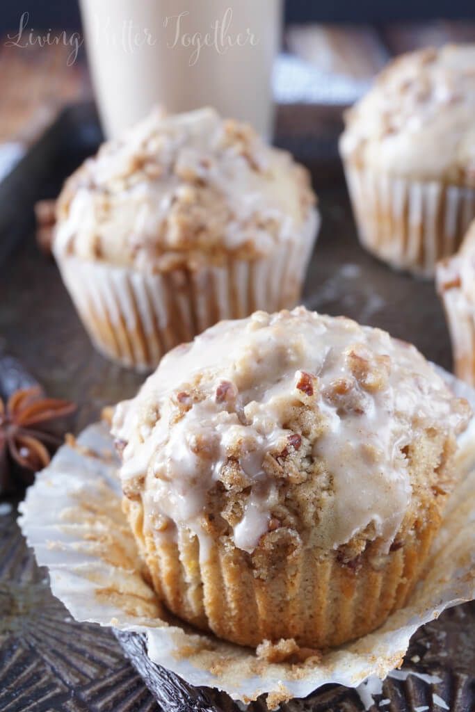 several muffins with icing and cinnamon on top