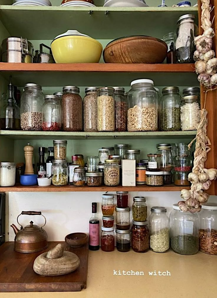 the shelves are filled with many different types of spices and other things to cook in