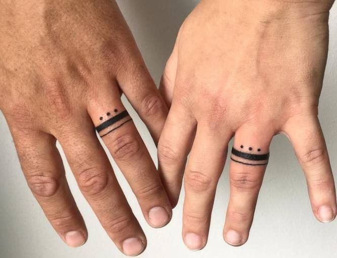 two people with matching rings on their fingers, one has an arrow and the other has a dotted line