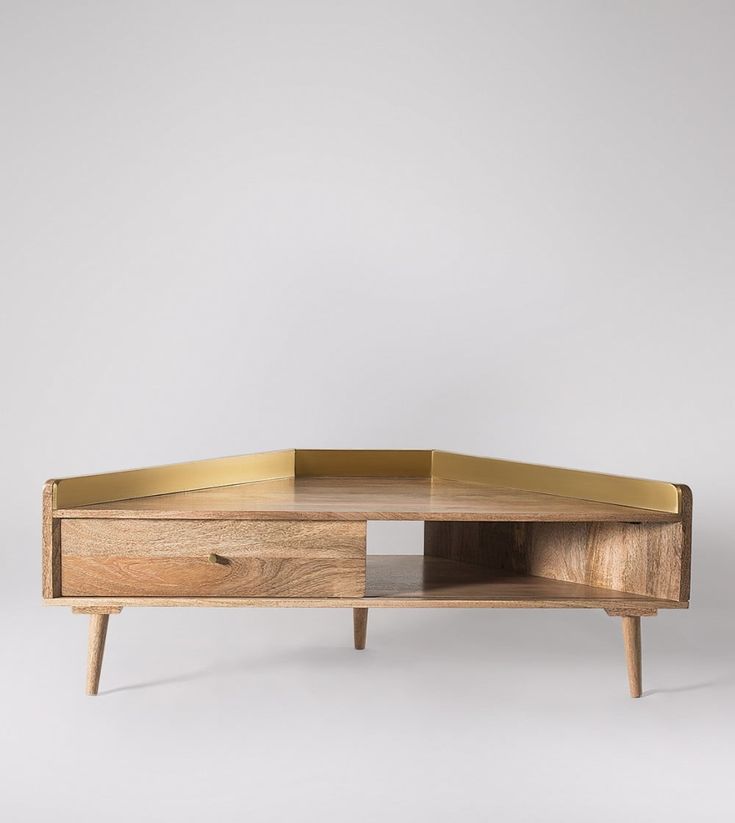 a wooden coffee table with two drawers on one side and an open drawer on the other