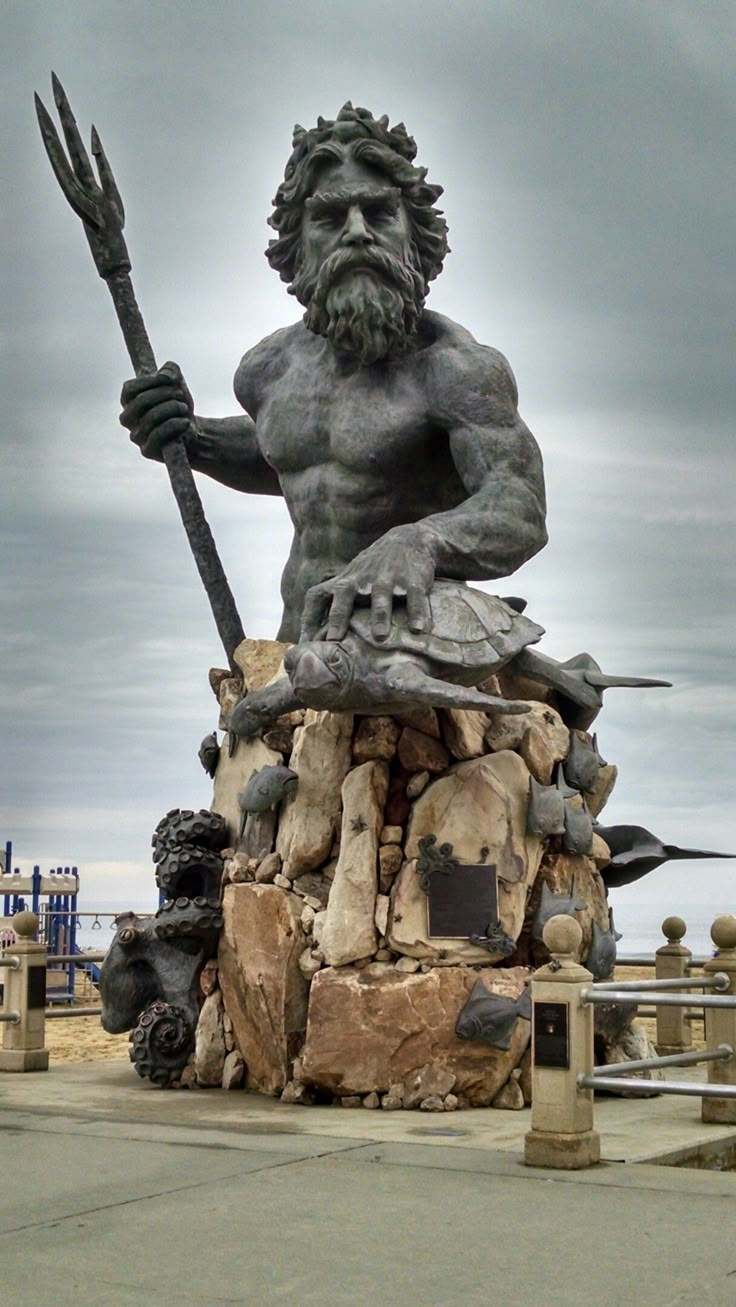 there is a statue of a man holding a spear