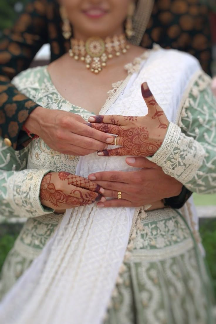 a woman with henna on her hands