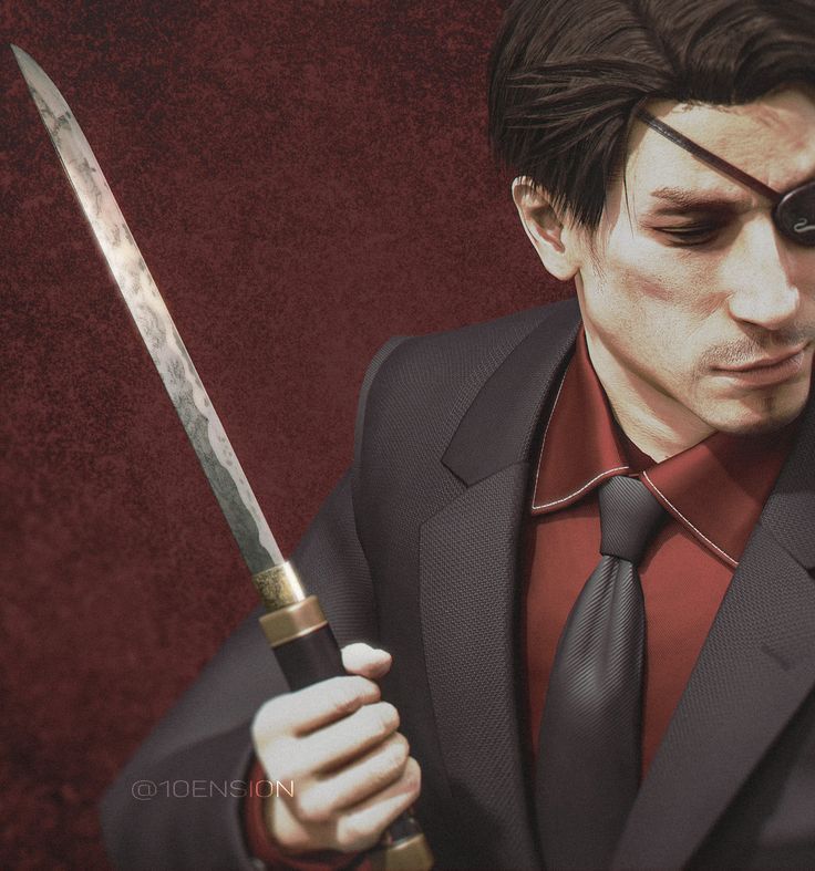 a man in a suit holding a knife