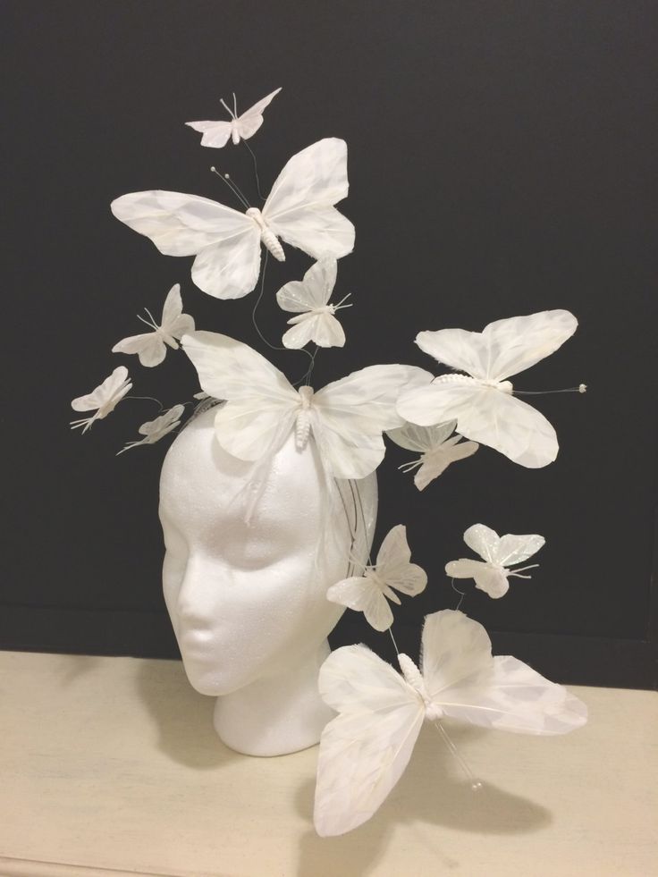 a head with white butterflies on it