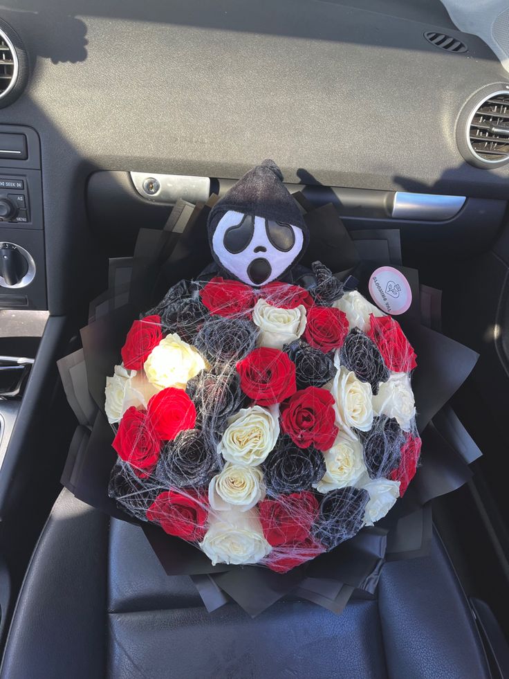 a bouquet of roses in the center of a car