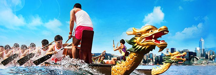 a group of people riding on top of a dragon boat in the middle of water