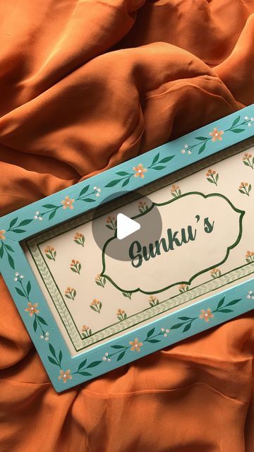 an orange blanket with a sign that says gunki's