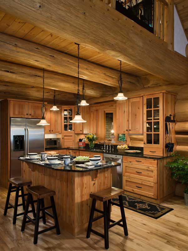 a large kitchen with wooden cabinets and an island