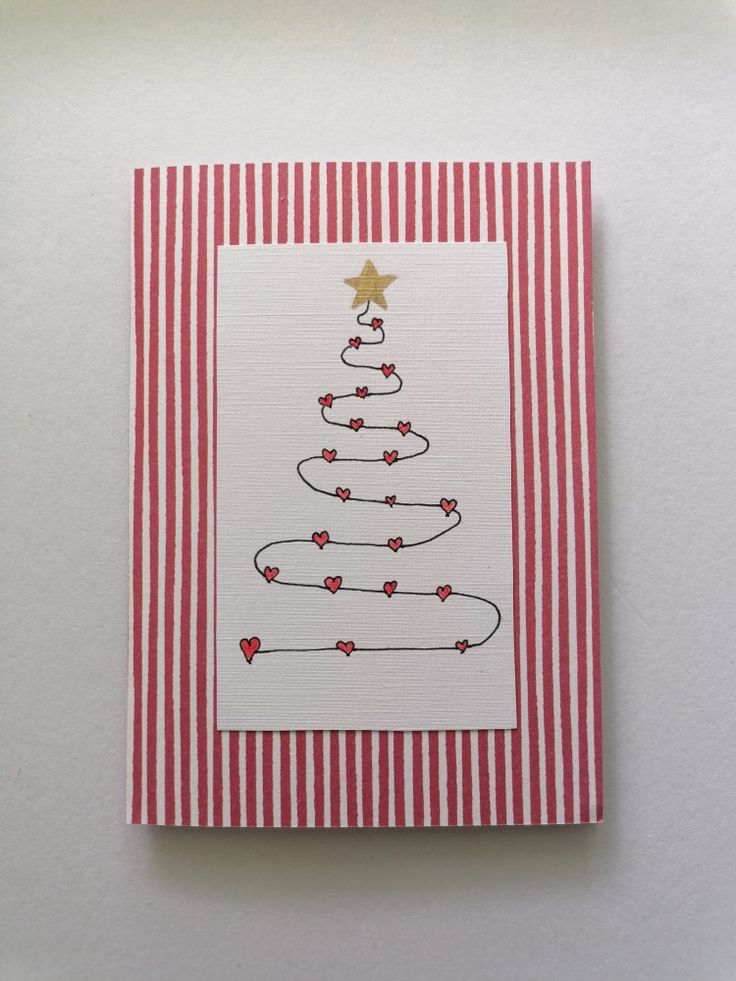 a card with a christmas tree on the front and red stripes around it, which has a gold star on top