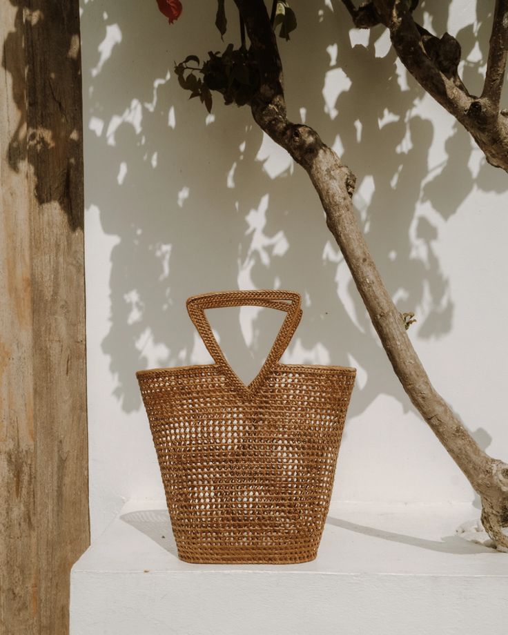 Triangle Rattan Handbag | Nomad Nextdoor | Handmade by Artisans Rattan Bags, Rattan Handbags, Accessory Inspo, Triangle Bag, French Market, Rattan Bag, The Triangle, Unique Bags, Golden Color