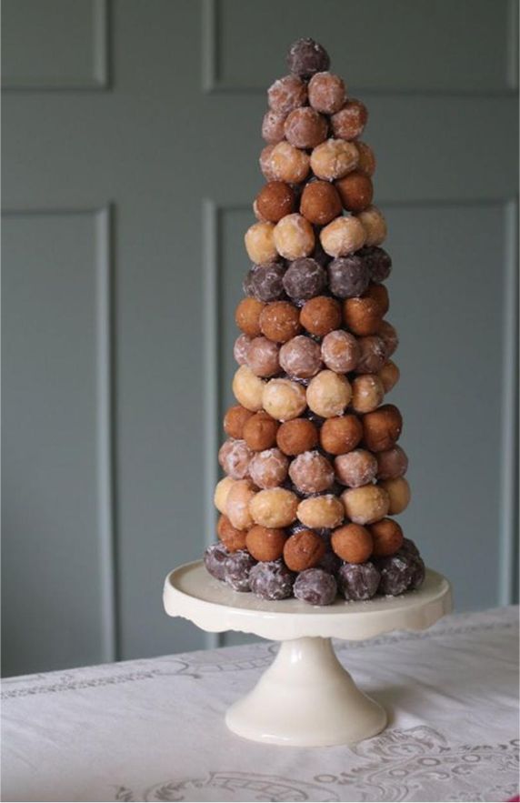 a cake made out of donuts sitting on top of a table