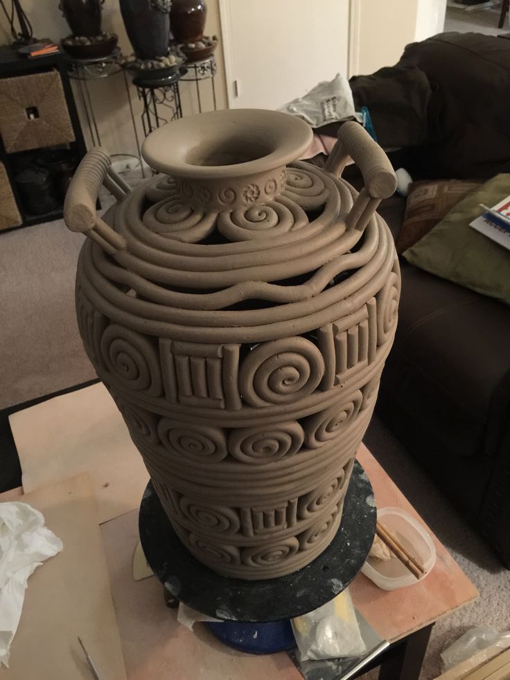 a large vase sitting on top of a table