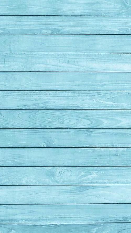 an old blue wood plank wall textured with light blue paint or varnishing