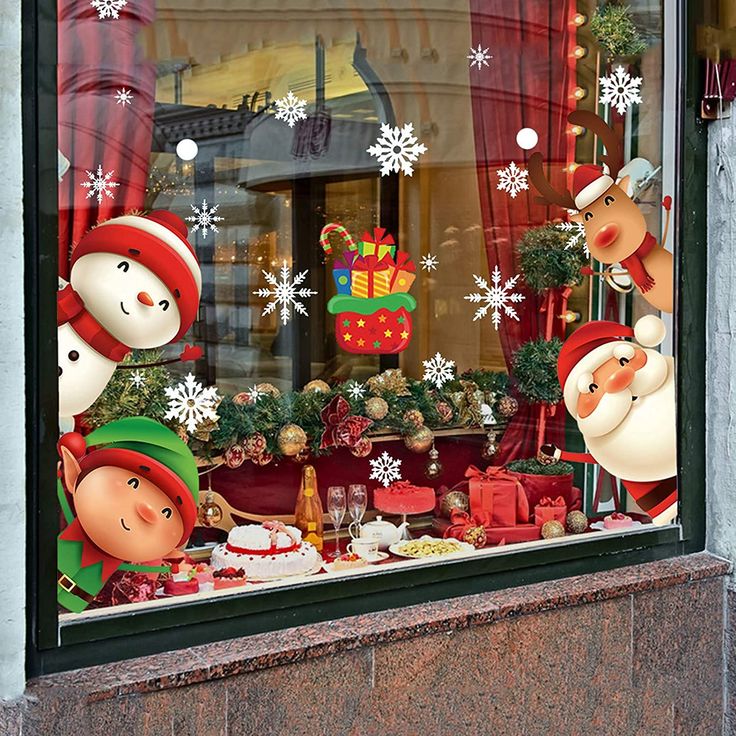 a store window with christmas decorations and snowmen