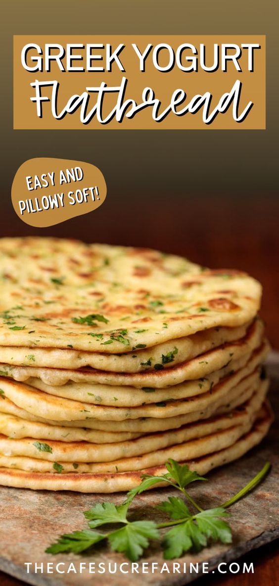 a stack of flatbreads sitting on top of a wooden table