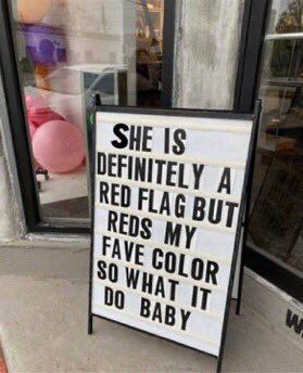 a sign that says he is definitely a red flag but reads my fave color so what it do baby