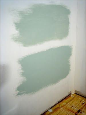 the wall is being painted with green paint